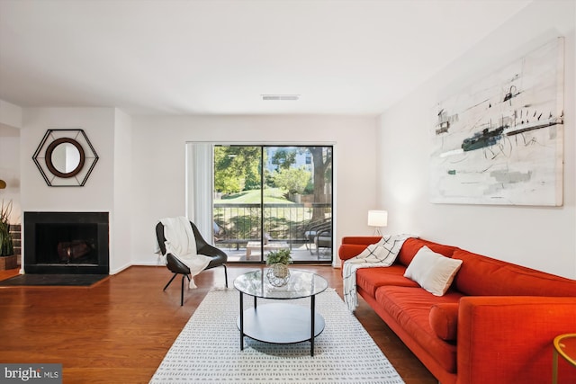 living room with dark hardwood / wood-style floors