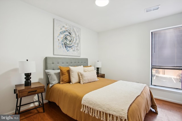 bedroom featuring dark hardwood / wood-style floors