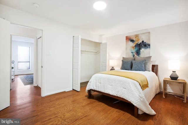 bedroom featuring a closet and hardwood / wood-style floors