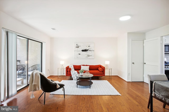 living area with wood-type flooring