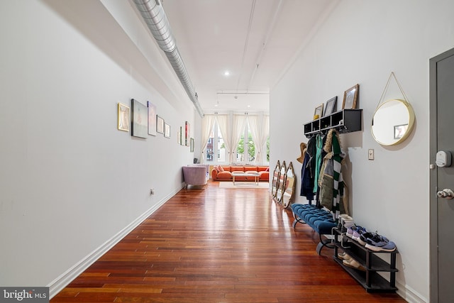 hallway with dark wood-type flooring