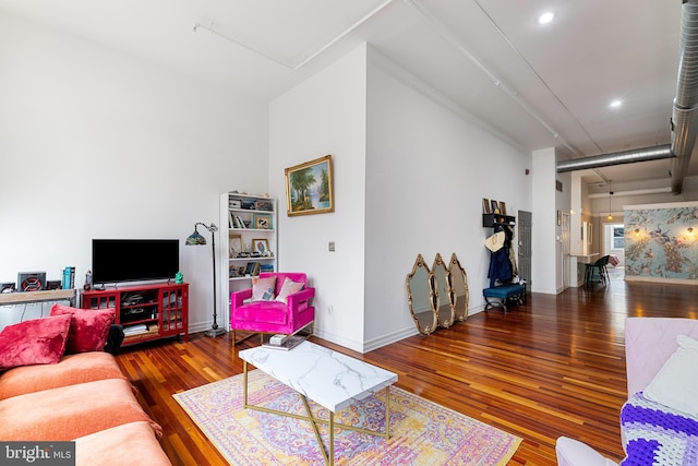 living room with dark hardwood / wood-style floors