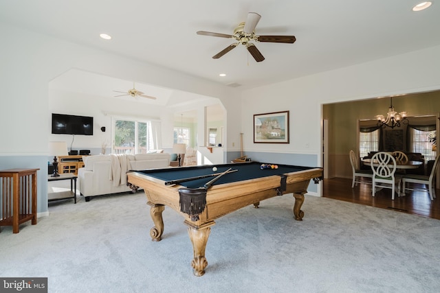 game room with hardwood / wood-style flooring, ceiling fan with notable chandelier, and pool table