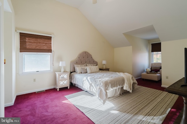 carpeted bedroom with vaulted ceiling