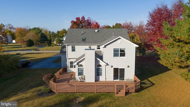 rear view of house with a lawn