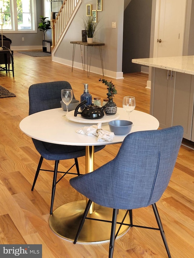 dining area with light hardwood / wood-style floors