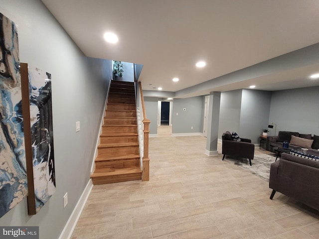 staircase with hardwood / wood-style flooring