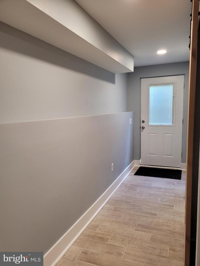 entryway with light hardwood / wood-style floors