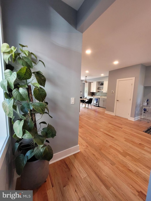 hall with light wood-type flooring