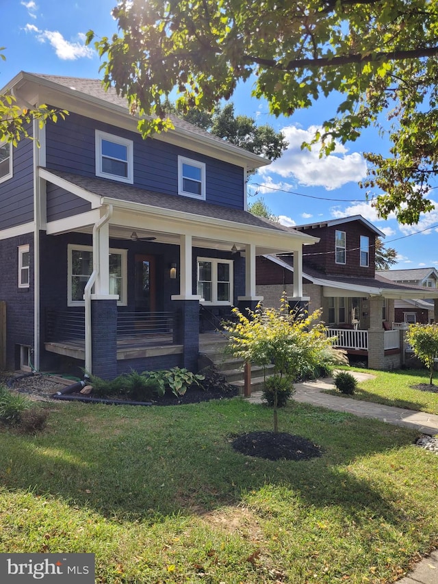 view of front of home featuring a front lawn and covered porch