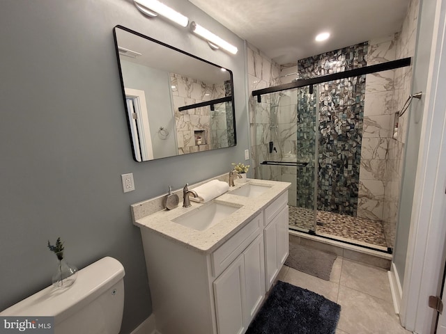 bathroom featuring vanity, tile patterned flooring, a shower with shower door, and toilet