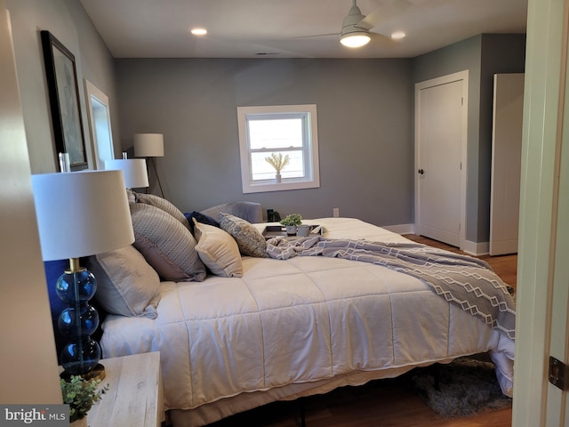 bedroom featuring light hardwood / wood-style floors and ceiling fan