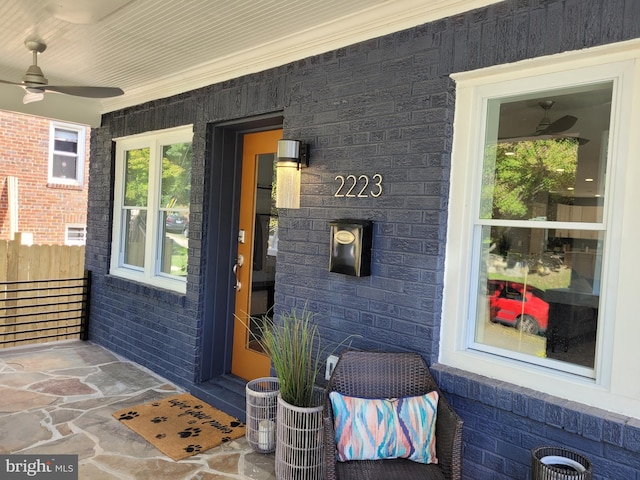 entrance to property with ceiling fan