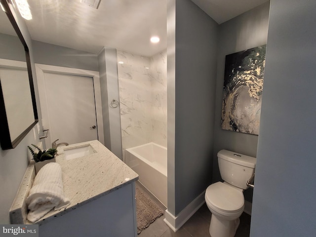 bathroom with vanity, tile patterned flooring, and toilet