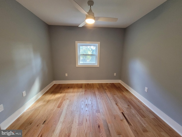 empty room featuring light wood-type flooring and ceiling fan