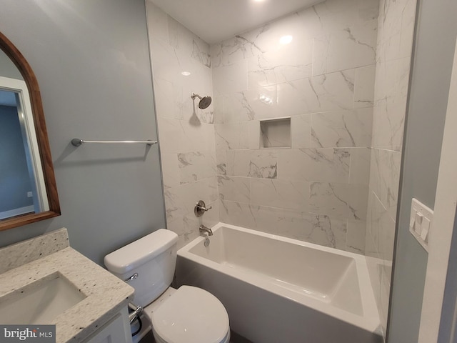 full bathroom with tiled shower / bath combo, vanity, and toilet