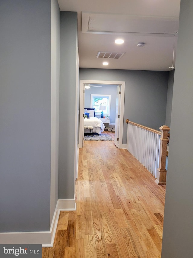 hall with light hardwood / wood-style floors