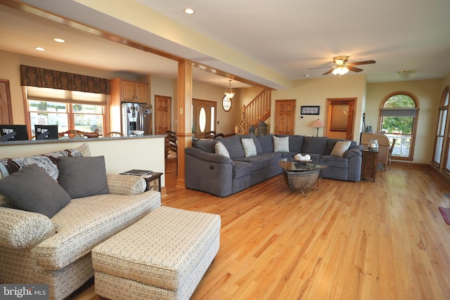 living room with ceiling fan and light hardwood / wood-style floors