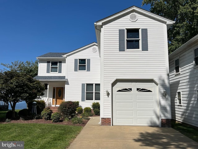 front of property with a garage and a front yard