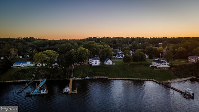 aerial view at dusk with a water view