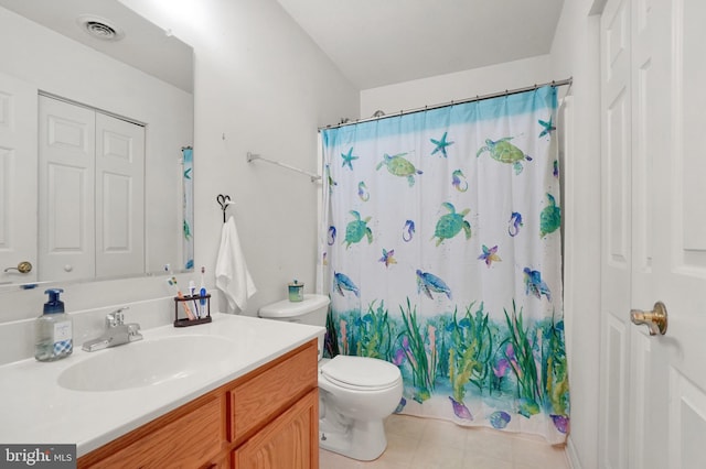 bathroom featuring vanity, toilet, and a shower with shower curtain