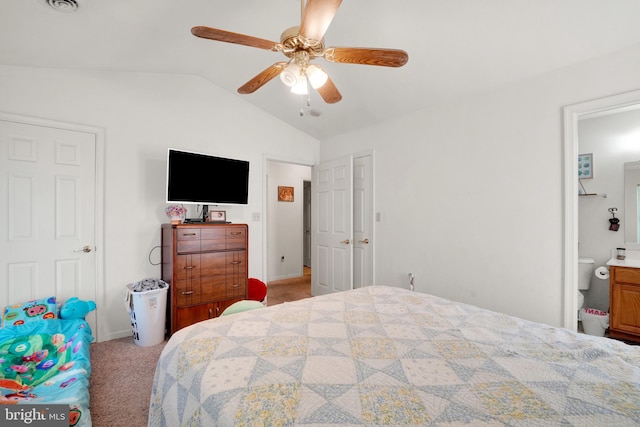 carpeted bedroom featuring ceiling fan, connected bathroom, and vaulted ceiling