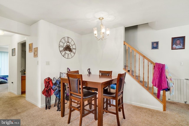 carpeted dining space with radiator and a notable chandelier