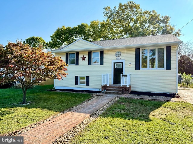 bi-level home with a front yard