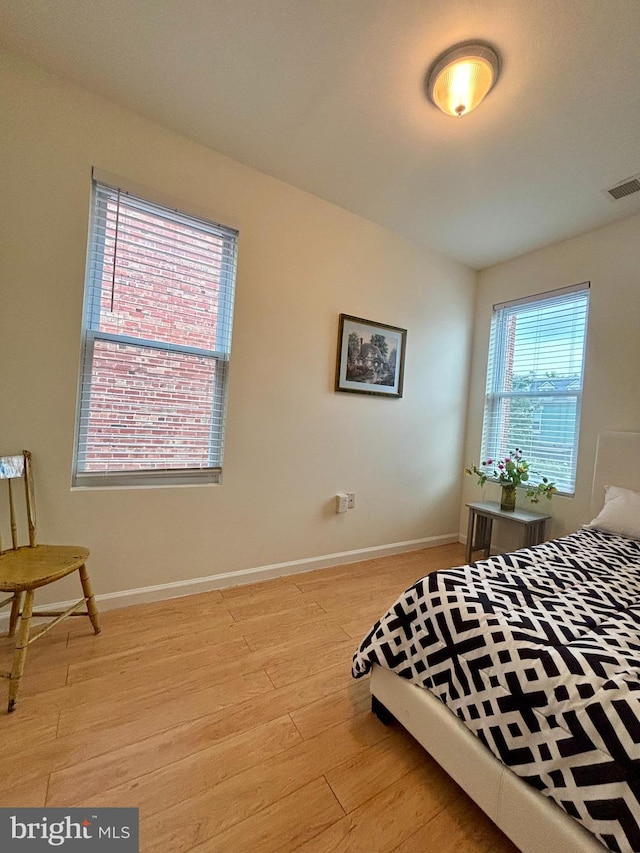 bedroom with light wood-type flooring