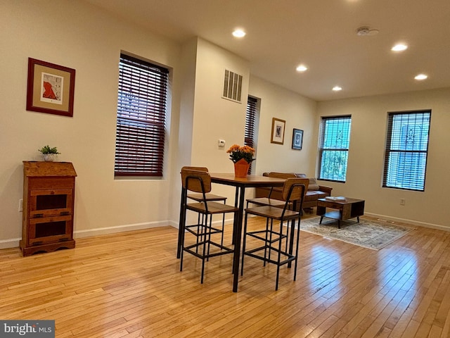 dining space featuring light wood-type flooring