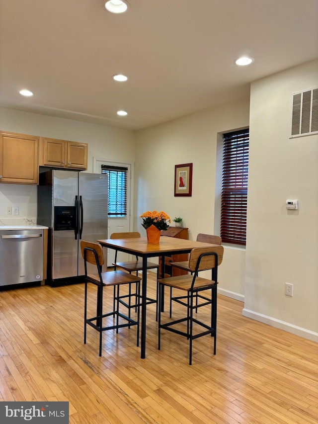 dining space featuring light hardwood / wood-style floors