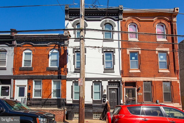 view of property featuring brick siding