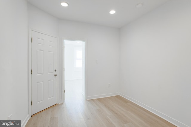 spare room with light hardwood / wood-style flooring