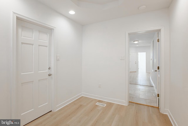 spare room with light hardwood / wood-style flooring