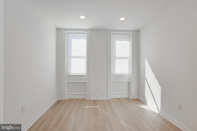 unfurnished room with light hardwood / wood-style floors