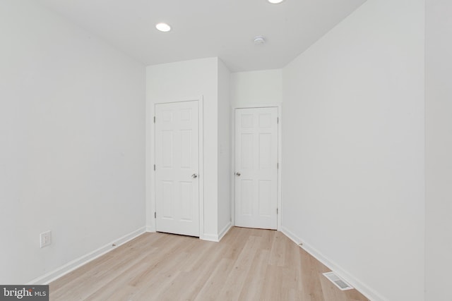 unfurnished bedroom featuring light wood-type flooring