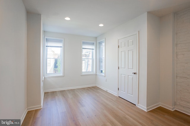 unfurnished bedroom featuring light wood-type flooring