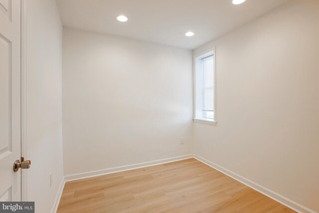 spare room featuring light hardwood / wood-style flooring