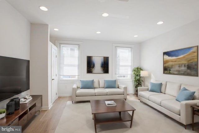 living room with light hardwood / wood-style flooring