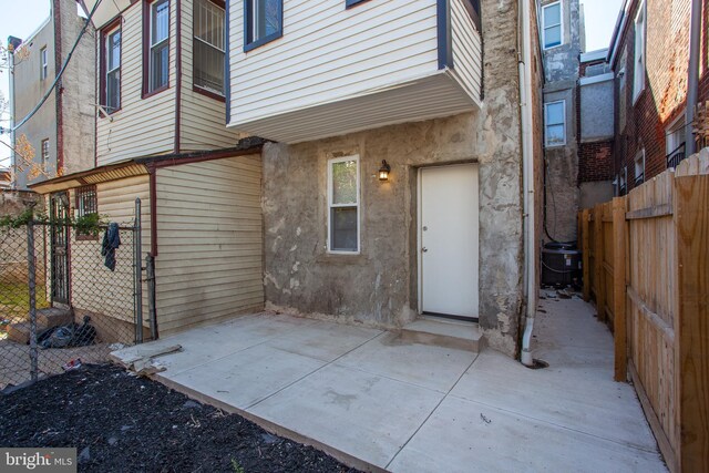 back of property with a patio