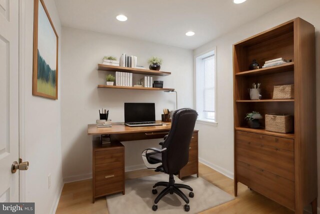 office with light wood-type flooring