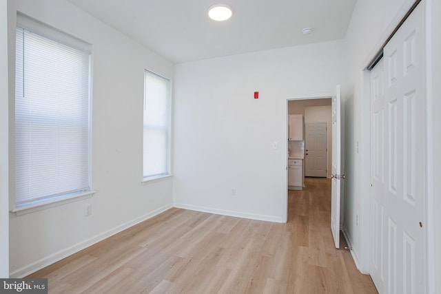 unfurnished bedroom with light hardwood / wood-style flooring