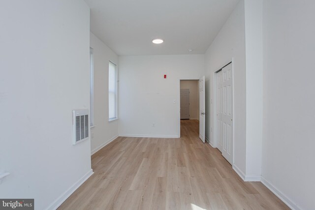 spare room with light hardwood / wood-style floors