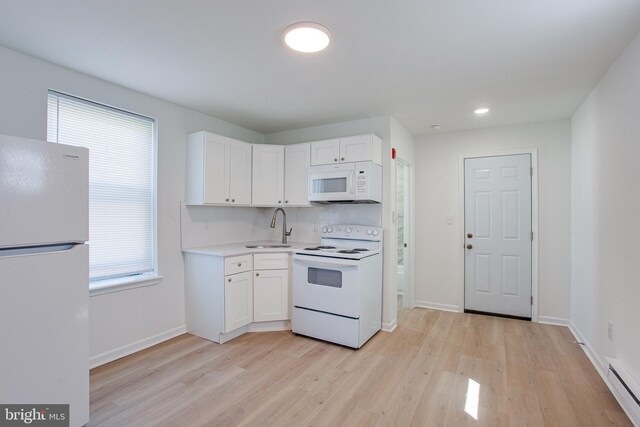 kitchen with light wood-type flooring, white appliances, white cabinetry, sink, and a baseboard heating unit