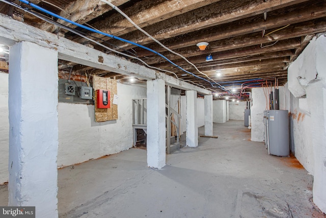 basement with gas water heater and water heater