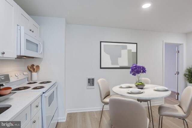 dining area featuring light hardwood / wood-style flooring