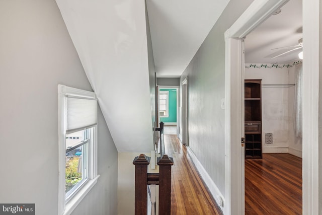 hall with wood-type flooring