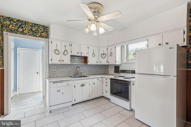 kitchen featuring white cabinetry, white appliances, light tile patterned floors, sink, and ceiling fan