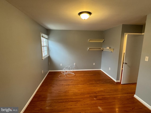 empty room featuring dark hardwood / wood-style flooring