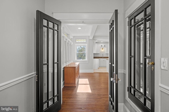 hall with dark hardwood / wood-style flooring